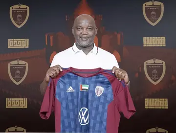 Pitso Mosimane with his Al Wahda shirt.