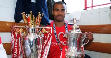 Ex-Arsenal star Ashley Cole with the Premier League trophy after the match between Arsenal and Everton on May 11, 2002 in London, England. (Photo by Stuart MacFarlane/Arsenal FC via Getty Images)