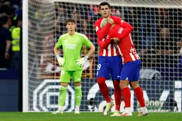 Atletico Madrid forwards Antoine Griezmann (R) and Alvaro Morata (L) both scored in the thrilling derby clash with Real Madrid on Sunday