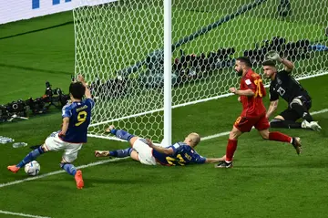 Kaoru Mitoma crosses the ball for Japan's second goal against Spain at the World Cup