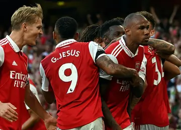 Arsenal celebrate their late winner against Fulham