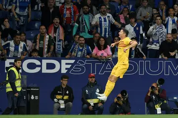 Barcelona's Polish forward Robert Lewandowski celebrates scoring the opening goal against Espanyol as his side won La Liga