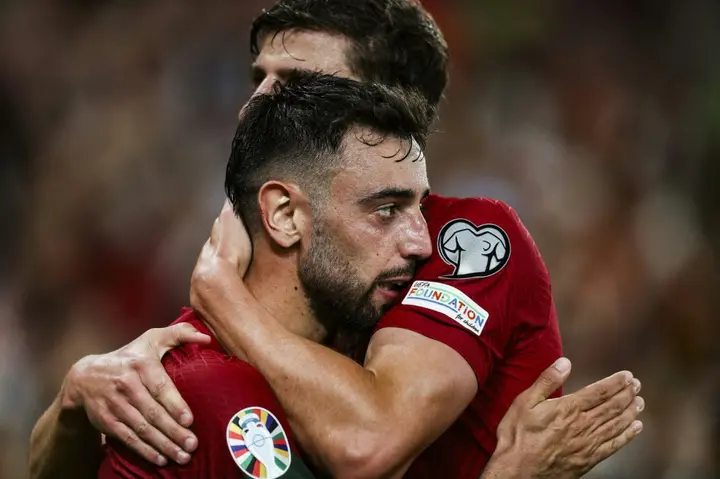 Bruno Fernandes celebrates with Ruben Dias after scoring one of his two goals as Portugal beat Bosnia and Herzegovina 3-0 in Euro 2024 qualifying