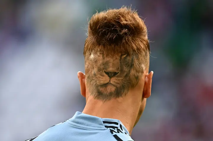 Losing their heads over football: Uruguay's goalkeeper Sebastian Sosa and his World Cup haircut