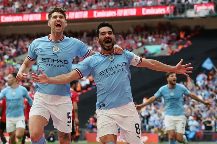 Two good: Ilkay Gundogan (right) scored twice to win the FA Cup for Manchester City