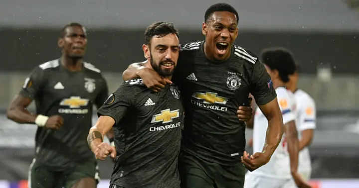 Bruno Fernandes of Manchester United celebrates with Anthony Martial after scoring his team's first goal from the penalty spot during the UEFA Europa League Semi Final between Sevilla and Manchester United (Photo by Ina Fassbender/Pool via Getty Images)