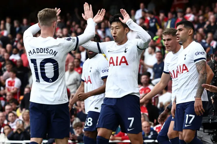 Tottenham's Son Heung-min (C) celebrates after scoring against Arsenal
