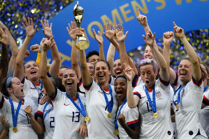 USA players celebrate with the trophy after winning the 2019 Women's World Cup in France