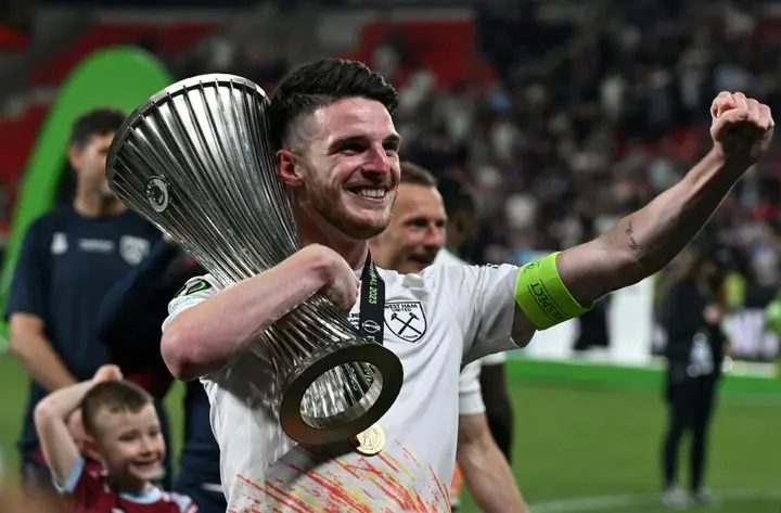 West Ham captain Declan Rice celebrates with the Europa Conference League trophy