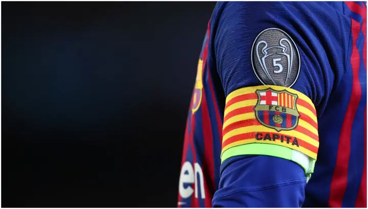 A detailed view of the captain's armband and UEFA Champions League badge on Lionel Messi's shirt. Photo by Robbie Jay Barratt. 