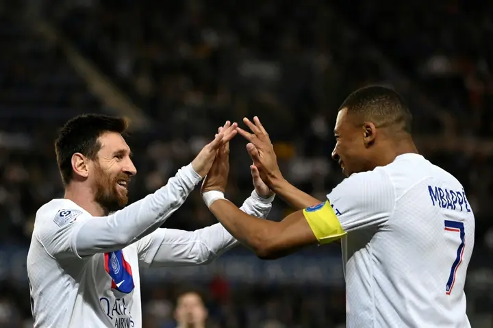 Lionel Messi celebrates with Kylian Mbappe after scoring for Paris Saint-Germain as they drew 1-1 in Strasbourg on Saturday to clinch the Ligue 1 title