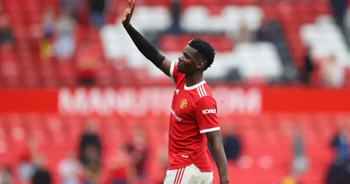 Paul Pogba acknowledges the fans following victory in the Premier League match between Man United and Leeds United at Old Trafford on August 14, 2021 in Manchester, England. (Photo by Catherine Ivill/Getty Images,)