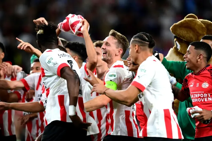 PSV Eindhoven celebrate the extra time goal that kept them  in the Champions League
