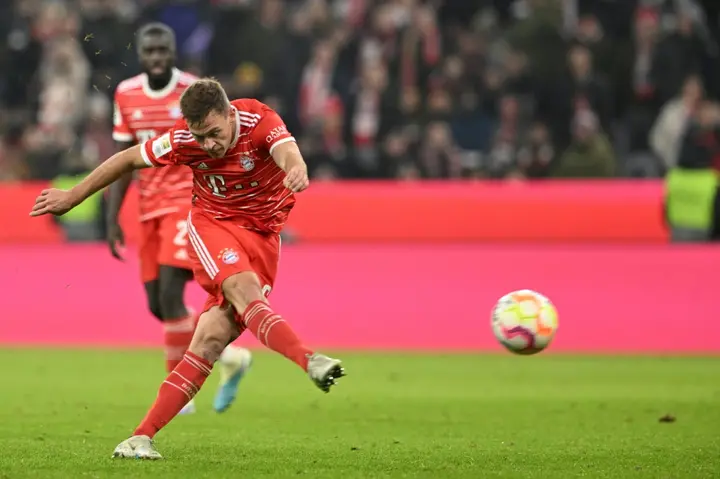 Bayern Munich's German midfielder Joshua Kimmich scores the equaliser as his side fought back to draw 1-1 with Cologne on Wednesday