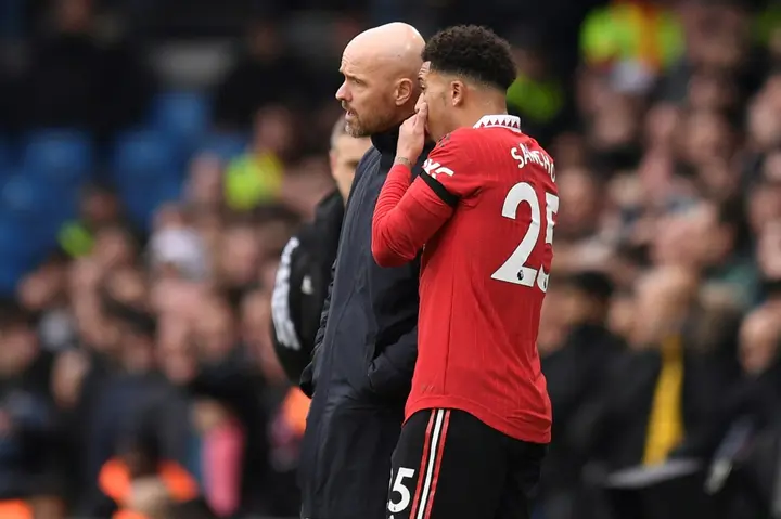 Jadon Sancho (right) has been ordered to train on his own by Manchester United boss Erik ten Hag (left)