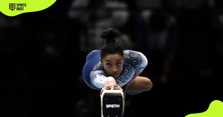 United States gymnast Simone Biles performs a routine on a balance beam.