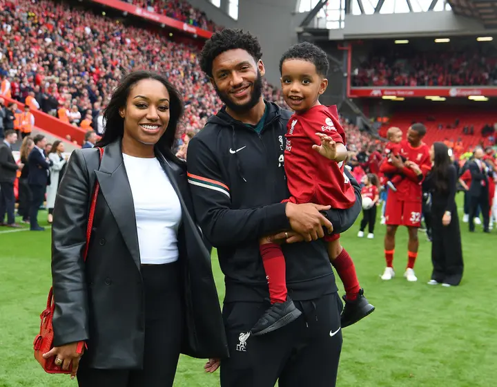 Joe Gomez with his wife and son