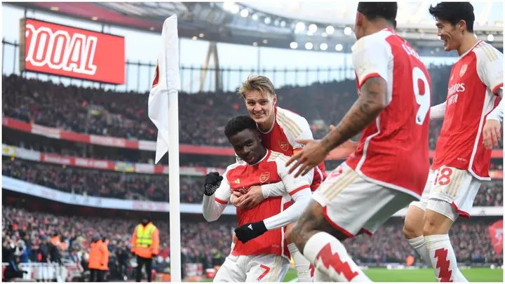 Bukayo Saka celebrates with teammates after scoring during the Premier League match between Arsenal FC and Wolverhampton Wanderers at Emirates Stadium. Photo by Stuart MacFarlane.