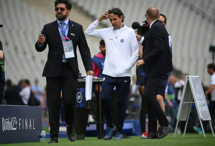 Inter coach Simone Inzaghi walks on the pitch at the Ataturk Olympic Stadium on Friday