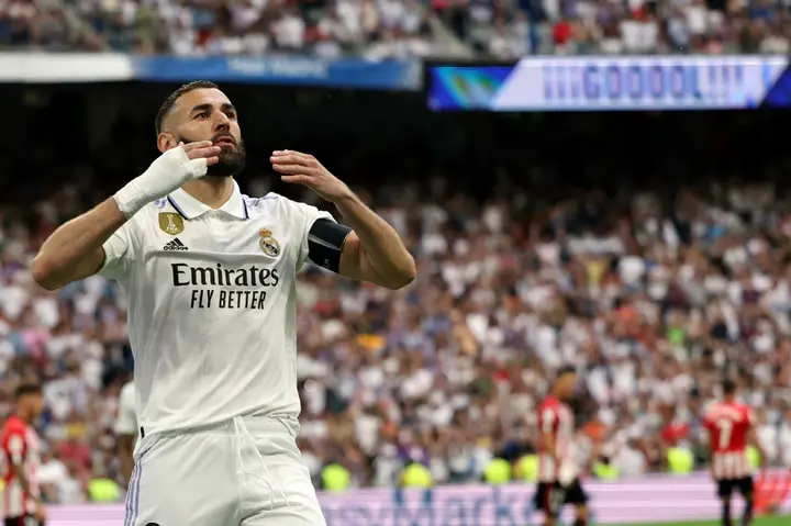 Real Madrid's French forward Karim Benzema celebrates scoring a goal from the penalty spot against Athletic Bilbao