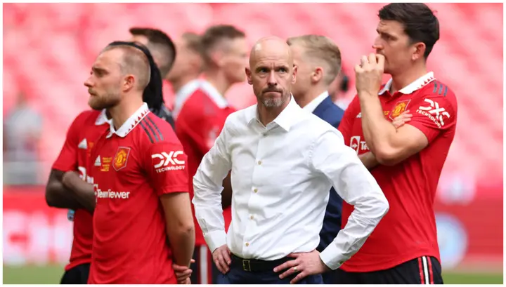 Erik ten Hag looks dejected with Harry Maguire and Christian Eriksen during the Emirates FA Cup Final match between Manchester City and Manchester United at Wembley Stadium. Photo by Marc Atkins.