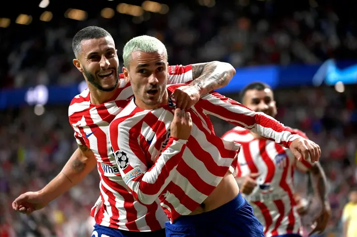 Antoine Griezmann (R) struck in the 11th minute of stoppage time to earn Atletico victory against Porto