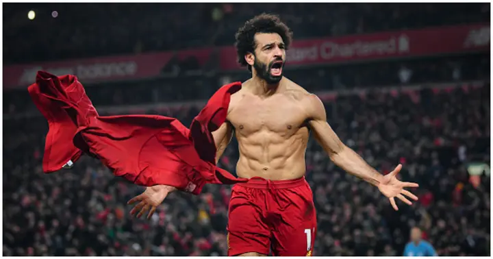 Mohamed Salah celebrates his goal to make it 2-0 during the Premier League match between Liverpool FC and Manchester United at Anfield. Photo by Michael Regan.