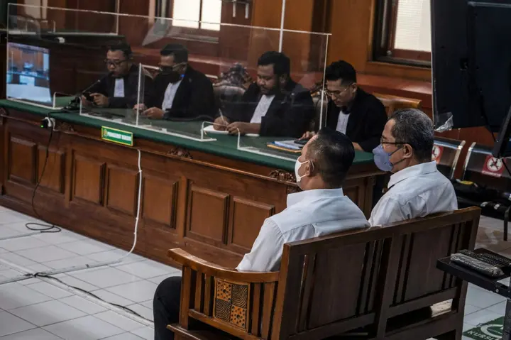 Suko Sutrisno (front L) and Abdul Haris (front R) attend their trial in Surabaya