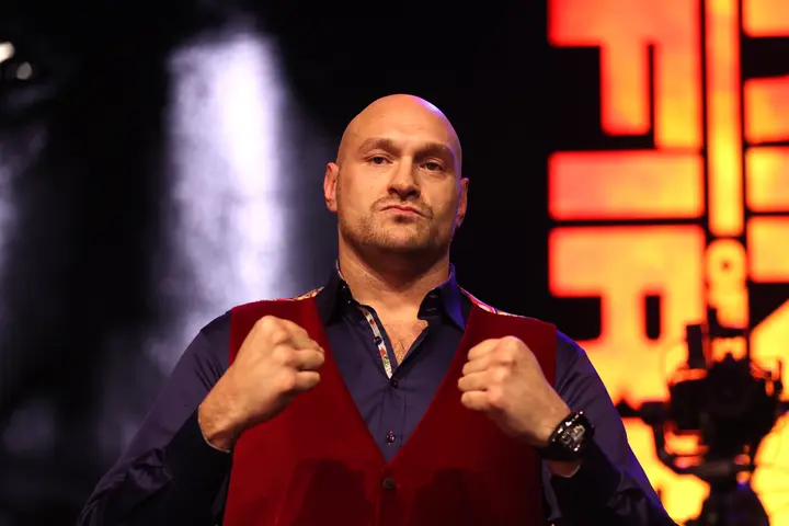 Tyson Fury posing at a press conference.