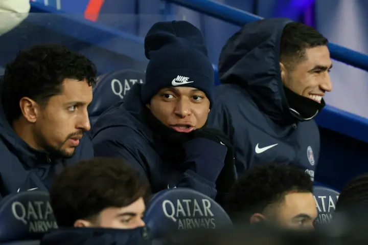 Kylian Mbappe (C) watched from the stands as PSG defeated Lille
