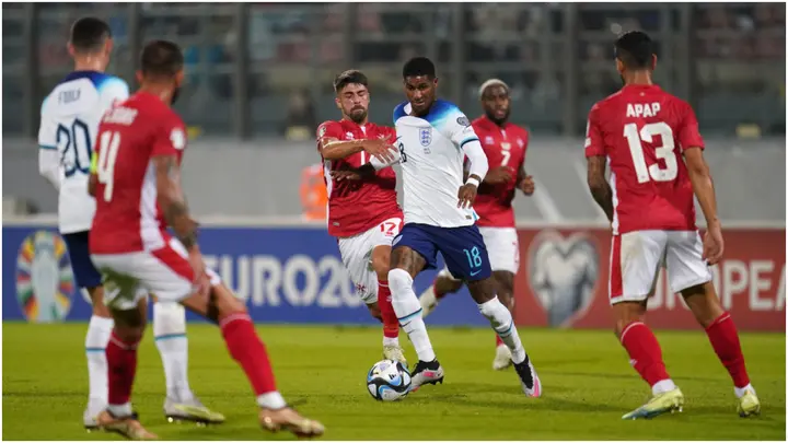 Marcus Rashford battles with Malta's Nicky Muscat during the UEFA Euro 2024 qualifier match at the National Stadium Ta'Qali, Attard. Photo by Nick Potts.