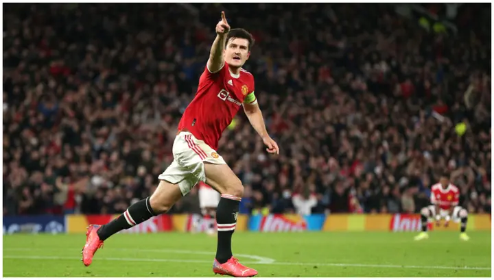 Harry Maguire celebrates after scoring during the UEFA Champions League match between Manchester United and Atalanta at Old Trafford. Photo by Charlotte Tattersall.