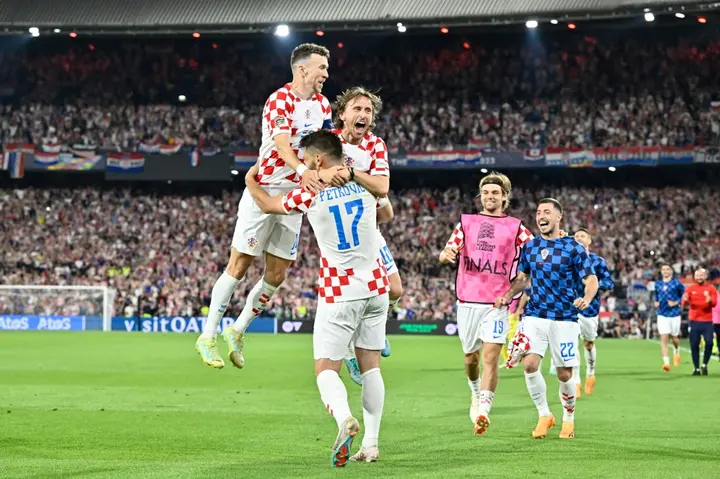 Croatia's Ivan Perisic (L) thinks the team's experience could count against Spain's younger side in the Nations League