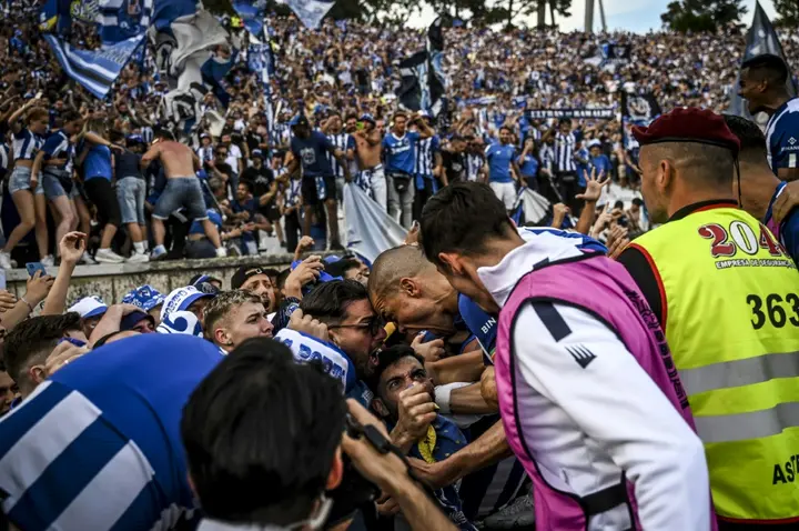 Porto's Portguese defender Pepe celebrates with supporters after Otavio scored the second goal