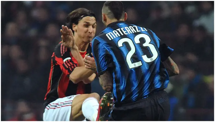 Marco Materazzi clashes with Zlatan Ibrahimovic during the Serie A match between Inter and AC Milan at Stadio Giuseppe Meazza. Photo by Valerio Pennicino.