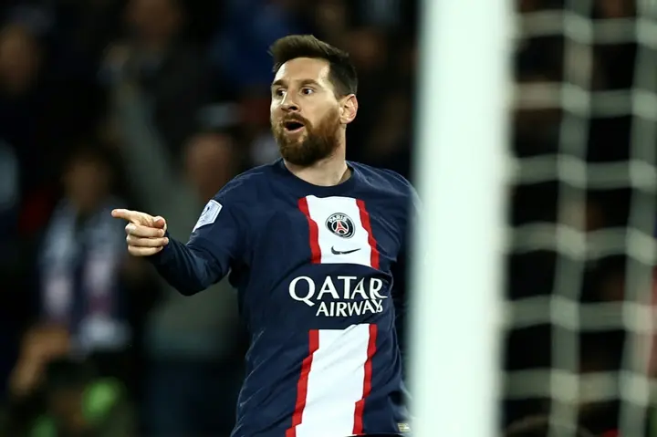 Lionel Messi celebrates after scoring in Paris Saint-Germain's win over title rivals Lens on Saturday