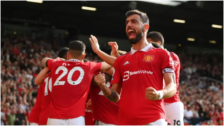 Manchester United players celebrate during the Premier League match between Manchester United and Arsenal FC at Old Trafford. Photo by Shaun Botterill.