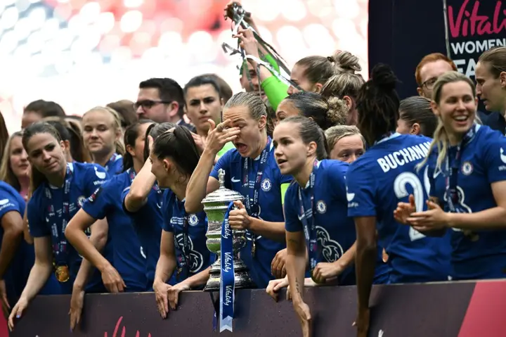Bowing out from the Blues - Chelsea captain Magdalena Eriksson holds the trophy while celebrating with teammates after her side's Women's FA Cup final win over Manchester United