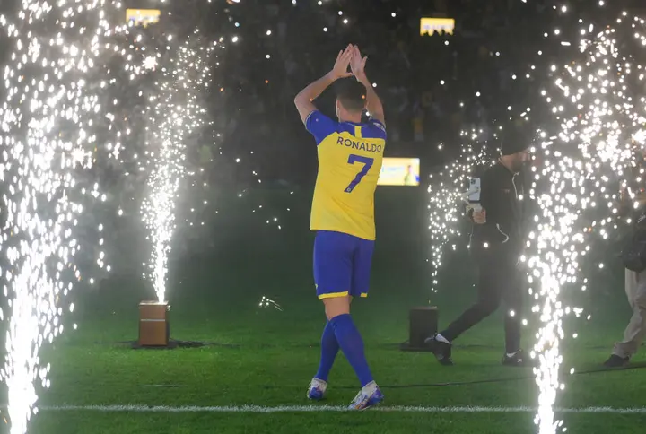 Cristiano Ronaldo applauds the fans as he is unveiled as an Al Nassr player.He had been rumored to be on the verge of a La Liga transfer.