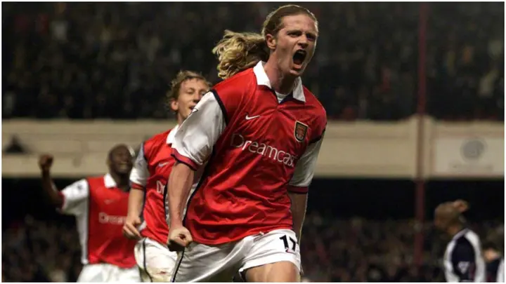Emmanuel Petit celebrates scoring the winning goal in the last minute during the match between Arsenal and West Ham United in the FA Carling Premiership at Highbury. Photo: Laurence Griffiths.