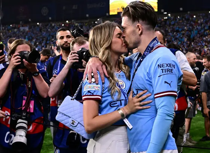 Manchester City forward Jack Grealish celebrates with his girlfriend Sasha Attwood after winning the Champions League