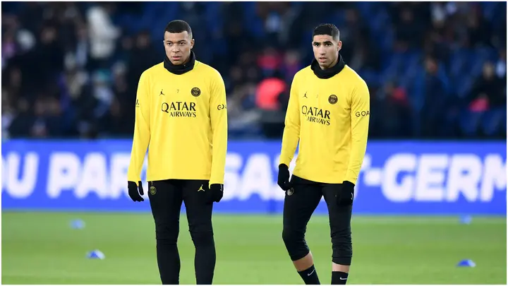 Kylian Mbappe congratulates Paris Saint-Germain teammate Achraf