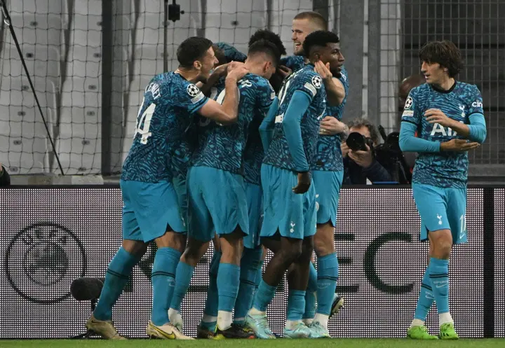 Tottenham players celebrate after scoring their late winner against Marseille