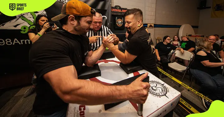 Elias Shammas (l) and Daniel Schwarz (r) compete during the 2021 98% Protest Series Arm Wrestling tournament.