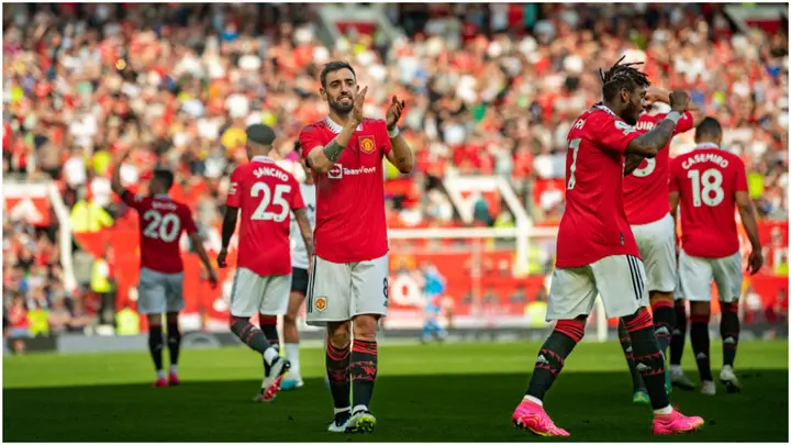 Bruno Fernandes celebrates with teammates after scoring during the Premier League match between Manchester United and Fulham FC at Old Trafford. Photo by Ash Donelon.